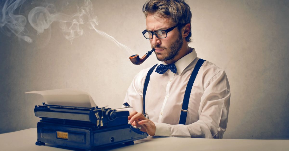 A man with glasses and a bow tie types on an old typewriter, embodying the essence to develop the main character.