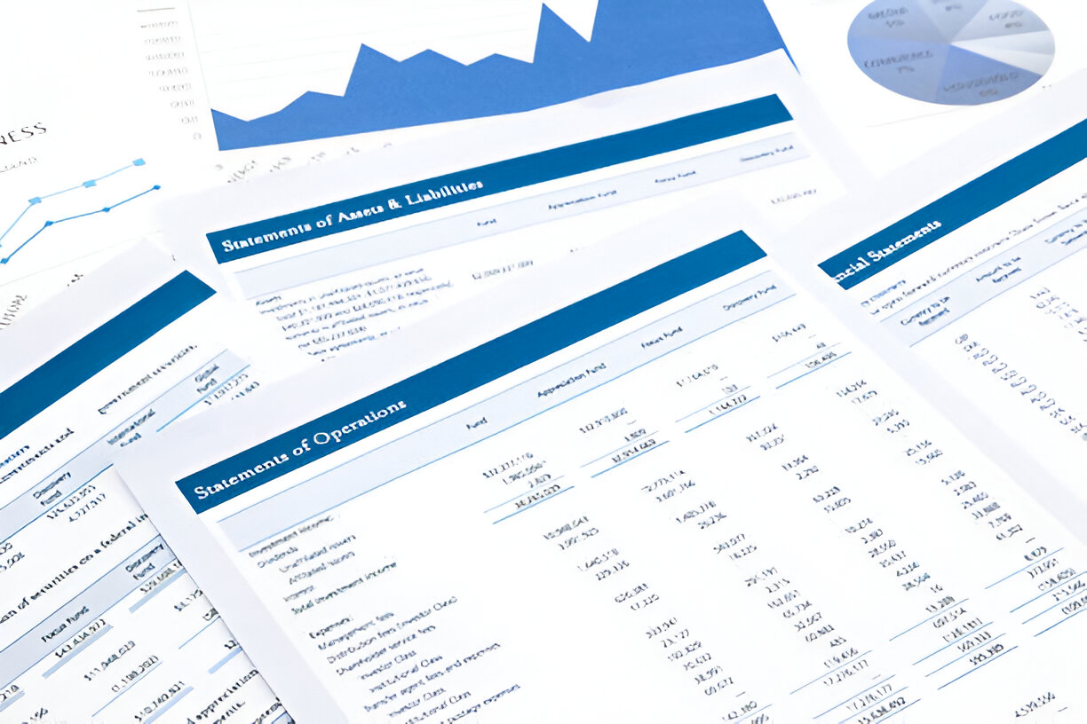 Printed financial documents showing income statements and balance sheets, key components in financial analysis.