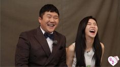 This is a picture of Jo Se Ho and his wife laughing to the camera