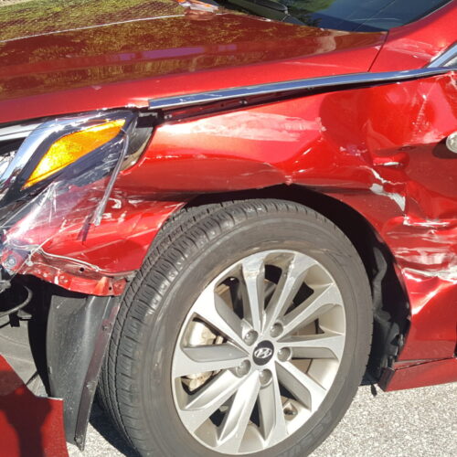 damaged drivers side of car after a drunk driving speeding accident in flordia