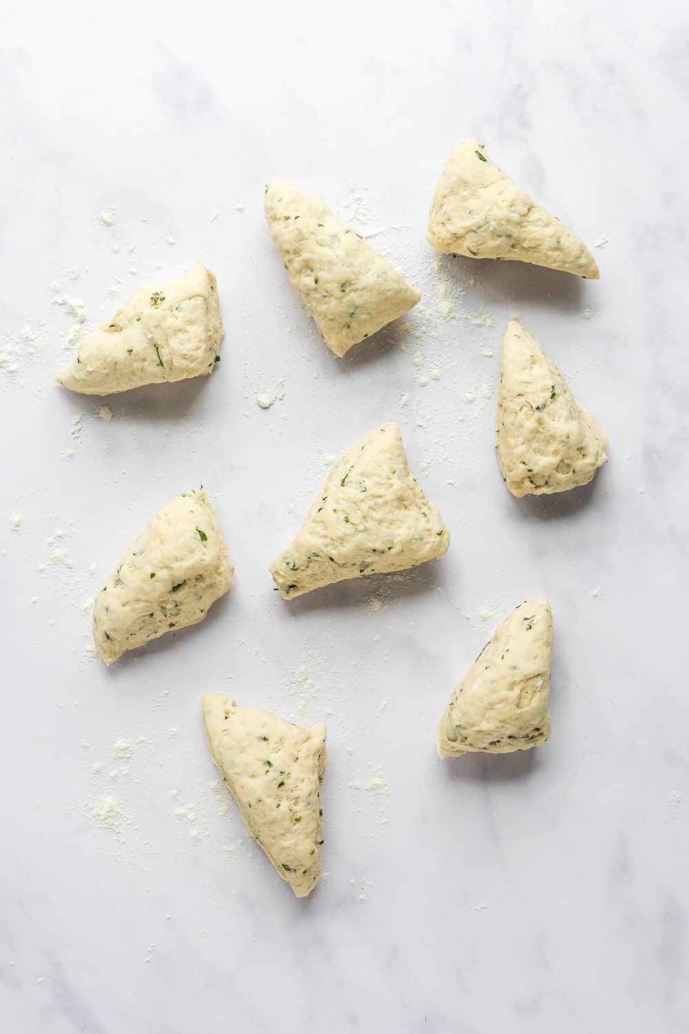 Divided naan bread dough pieces.