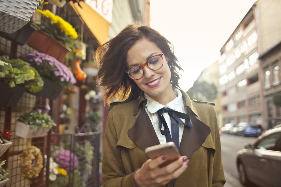 Photo by Andrea Piacquadio: https://www.pexels.com/photo/woman-beside-flower-shop-using-smartphone-3772531/ 