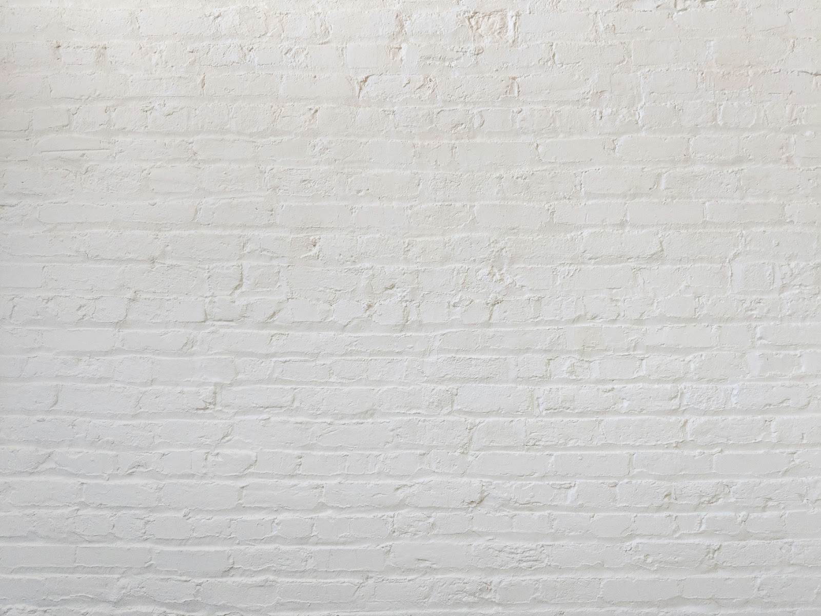 A smart thermostat installed on a wall showing settings