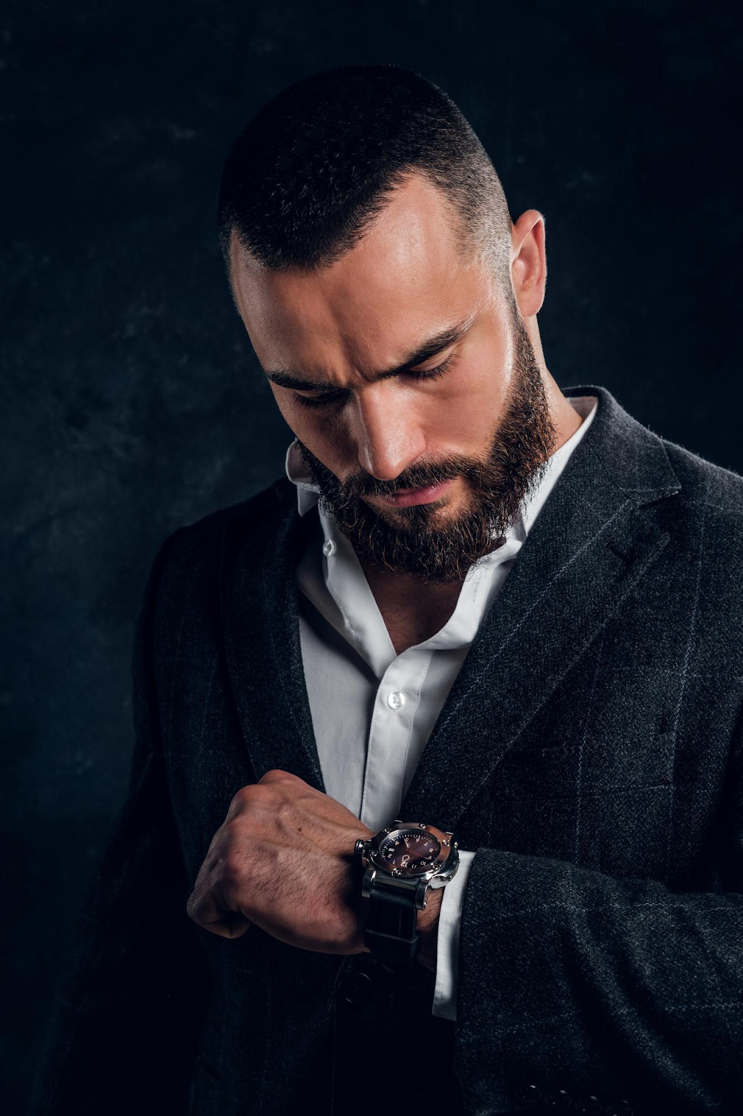 Elegant classic wristwatch paired with a formal suit, showcasing timeless design and sophistication for dress occasions.