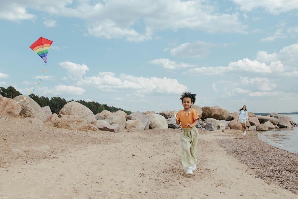  A kid playing a kite
