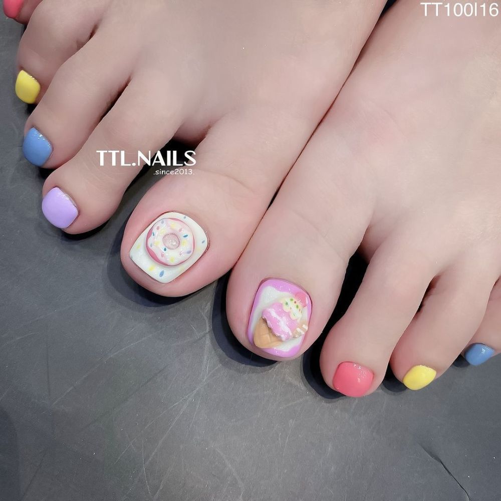 Close up of foot with radiant toe nail having Ice Cream Theme