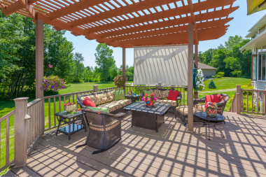 whens the best time of year to remodel your michigan outdoor deck with pergola and living area custom built okemos