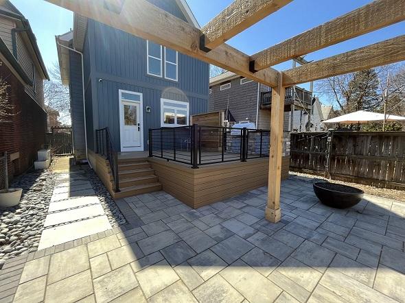 A deck with a pergola and a fence

AI-generated content may be incorrect.