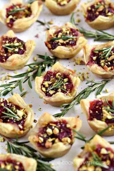 Puff-Pastry-Cranberry-Brie-Bites-topped-with-fresh-rosemary-and-chopped-pistachios.-cookingwithcurls.com_-1025x1536