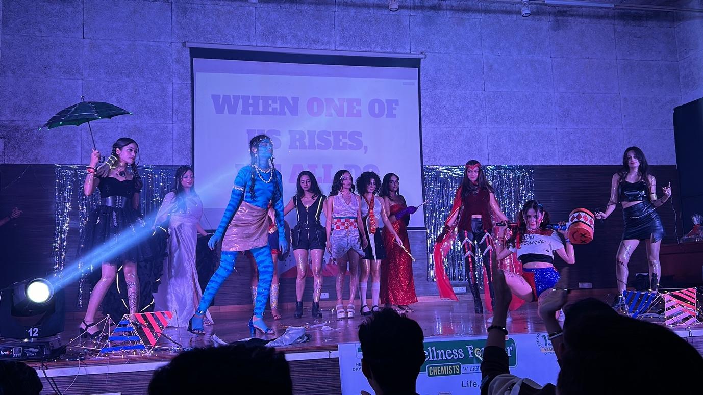 A group of people on a stage
Description automatically generated