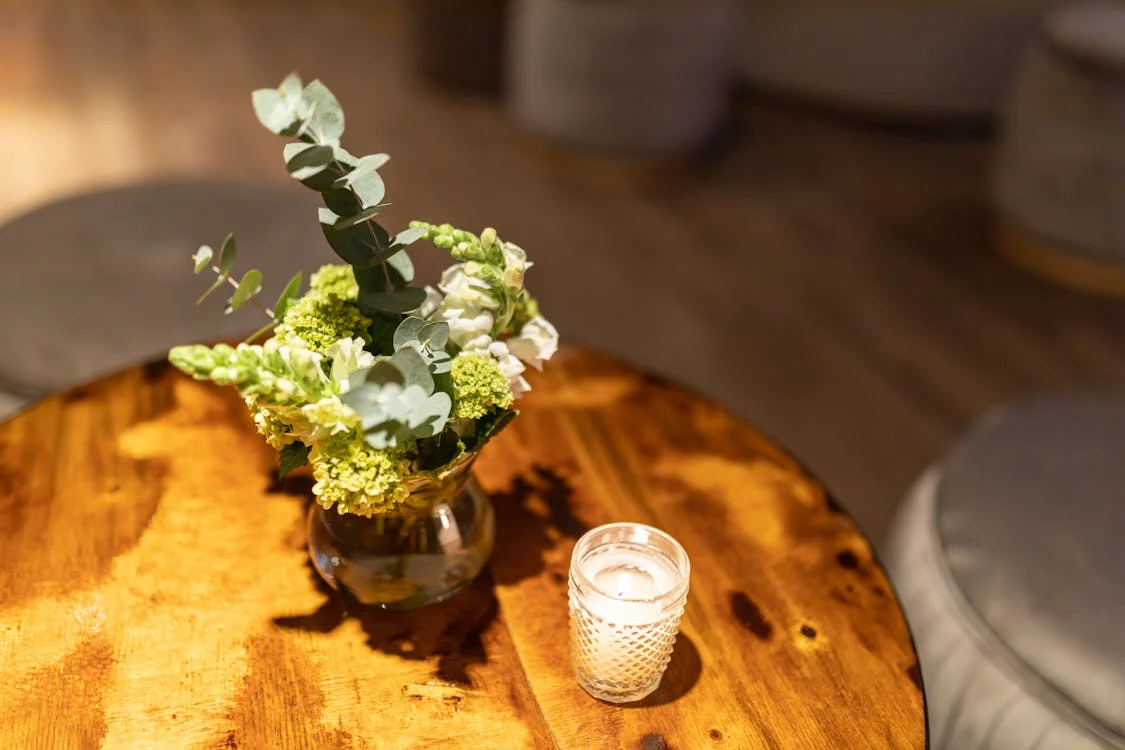 green flowers and candle