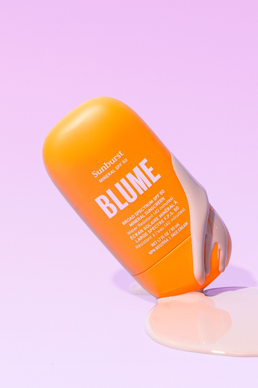 Aesthetic product shot of Blume Sunburst SPF 50 with creamy mineral sunscreen swatch