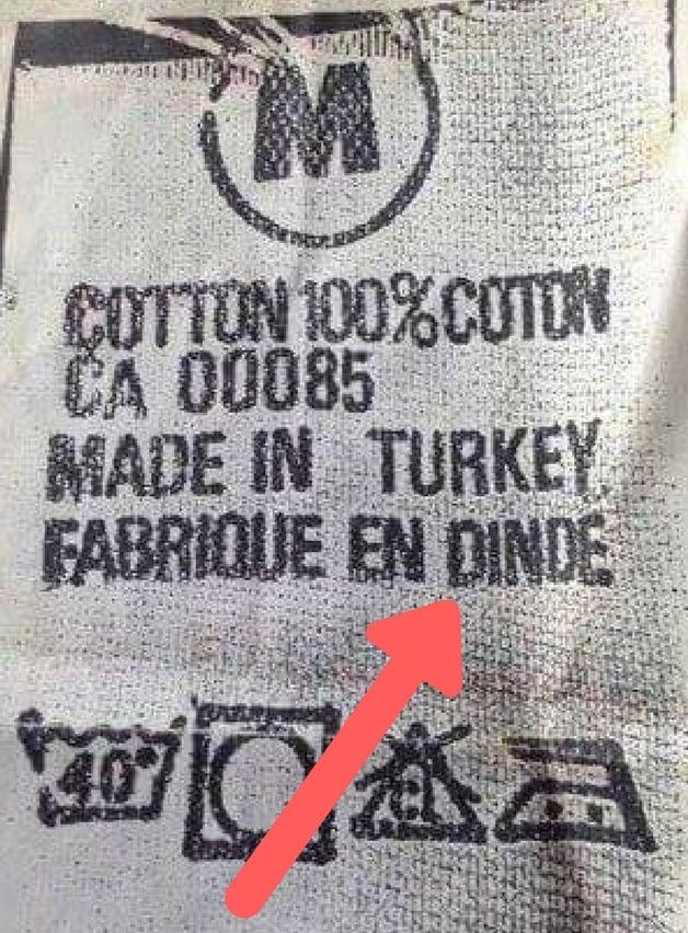 A close up of a fabric label

Description automatically generated