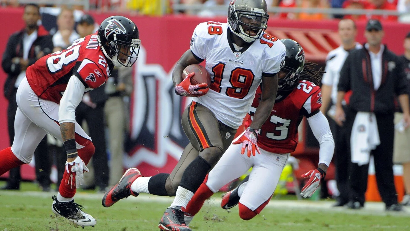 Russell Wilson of the Tampa Bay Buccaneers runs for a touchdown against the Atlanta Falcons during an NFL game in Atlanta.