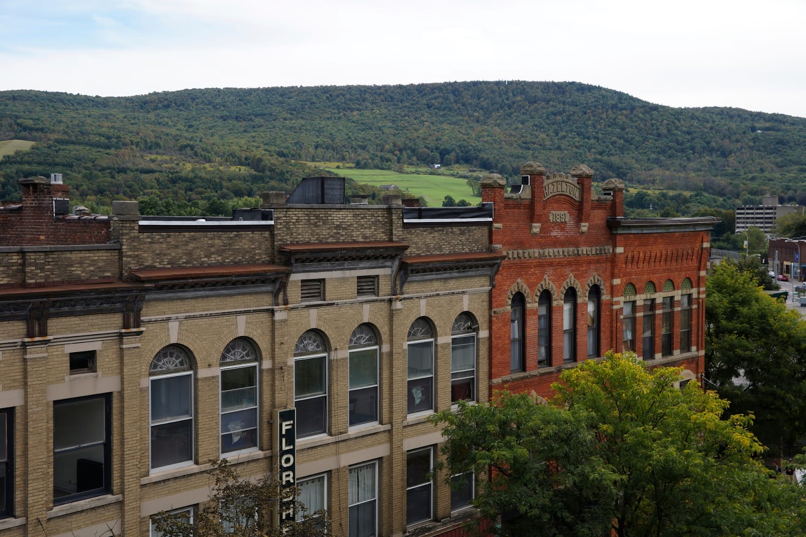 New York building with mountains in the background.