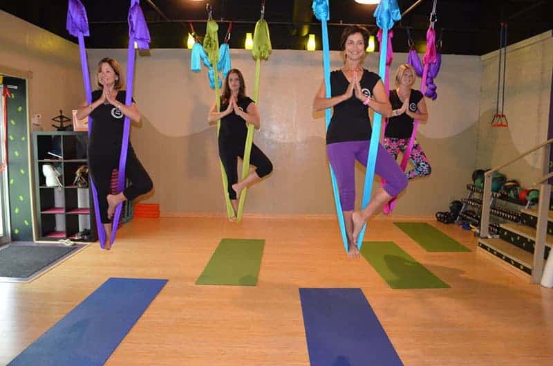 women doing aerial yoga