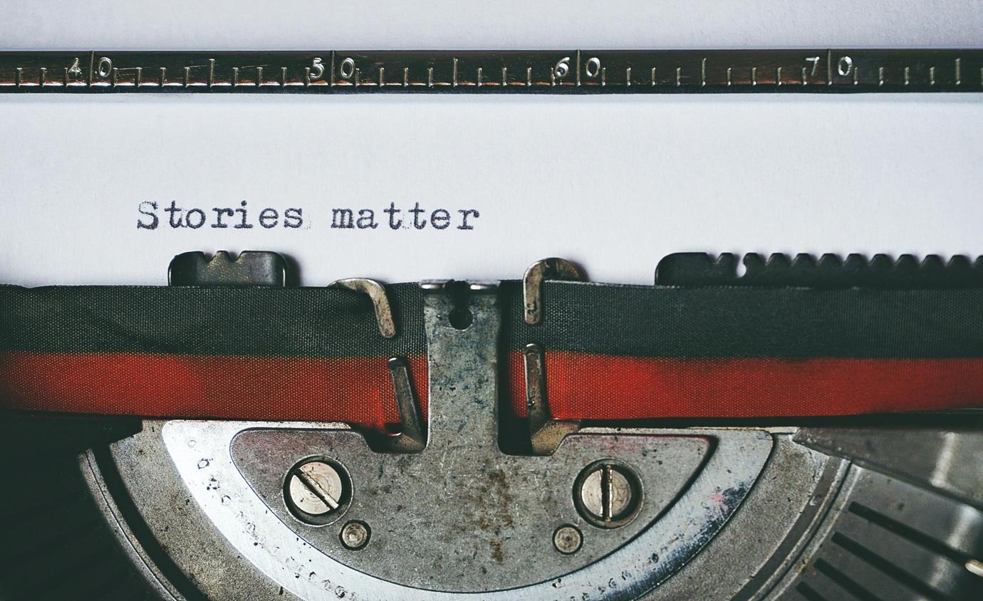 A typewriter with a piece of paper

Description automatically generated