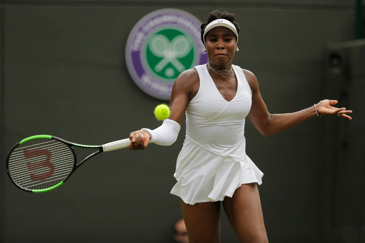 Venus Williams wearing a colorful tennis outfit at Wimbledon 2025

