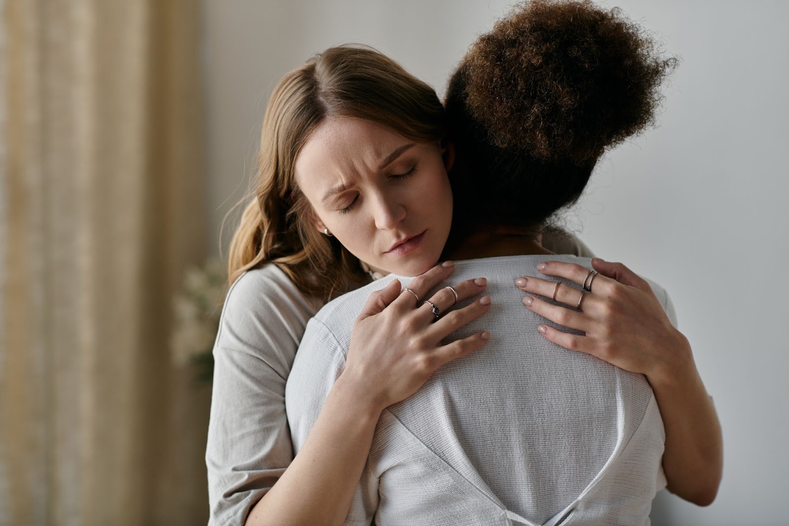 Two women hugging. 