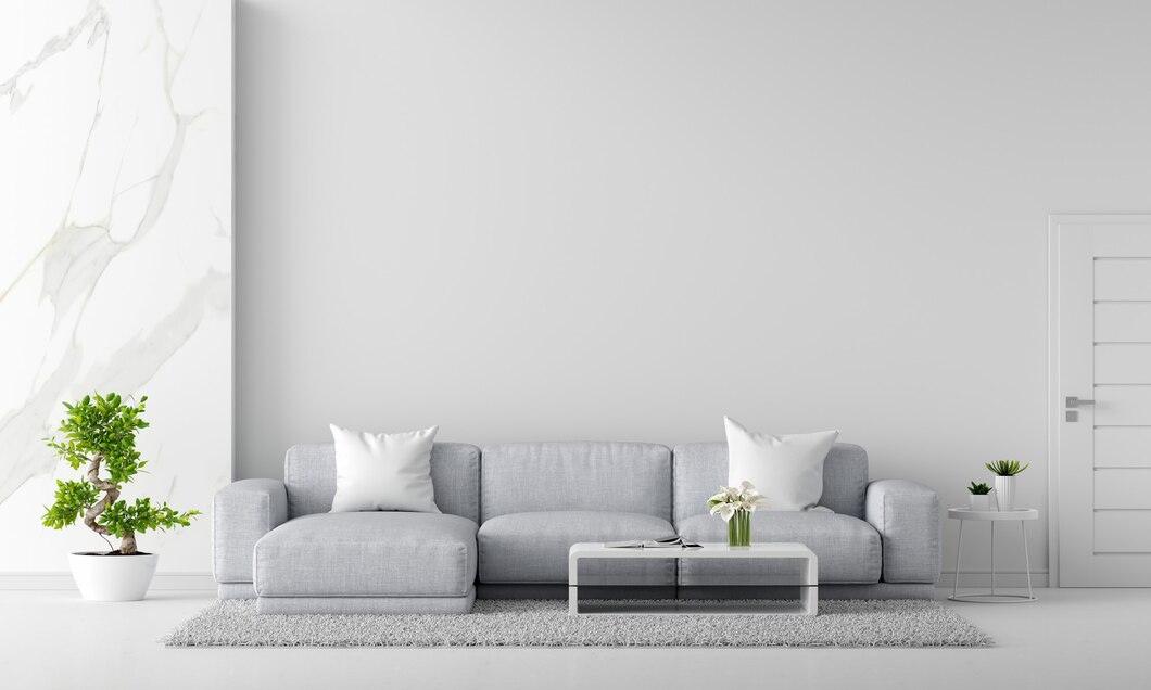 A white living room with a couch and a coffee table  Description automatically generated