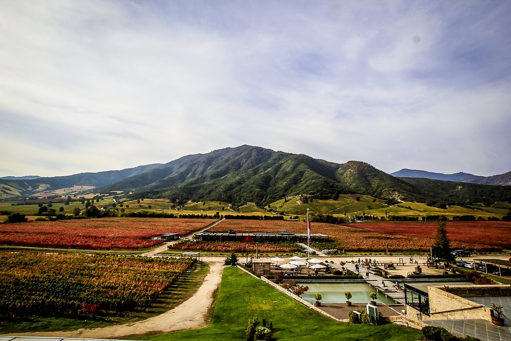 Mountains with a farm in the foreground.