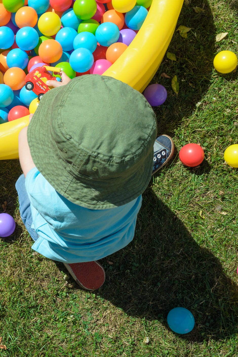 easter egg hunt ideas, children playing in a ball pit outside