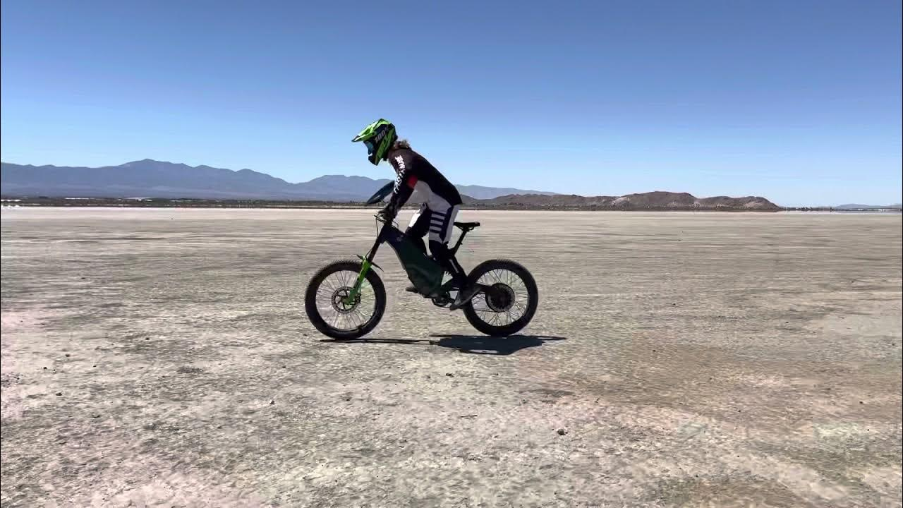 This image shows the man riding an Hi Power Cycles Revolution X E-Bike.