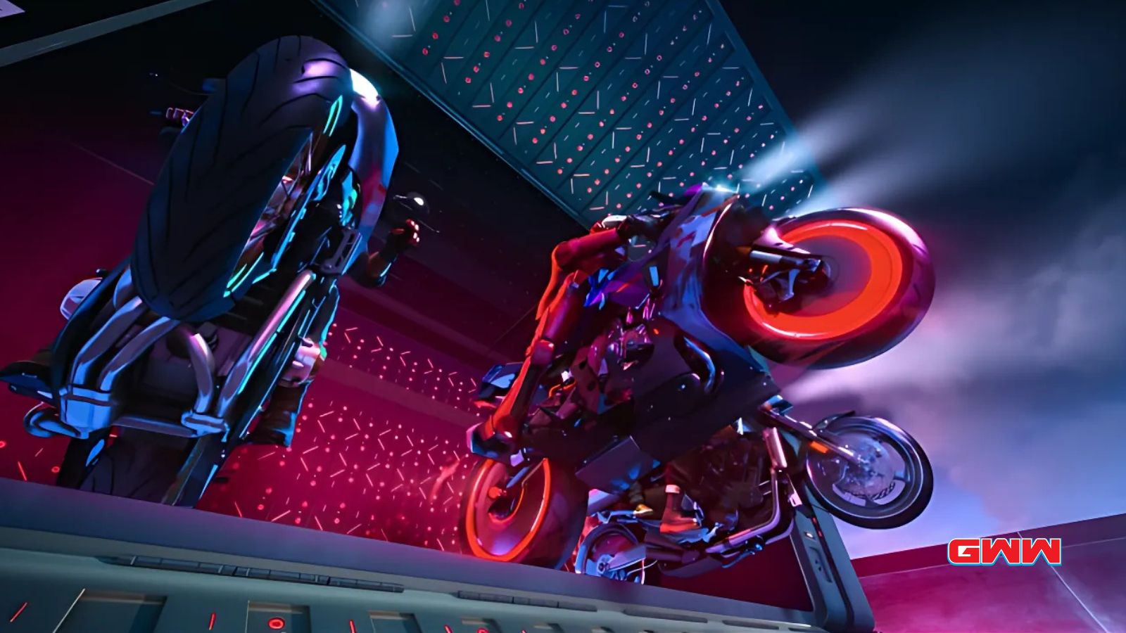 Close-up of two motorcyclists performing a wheelie in neon-lit environment.