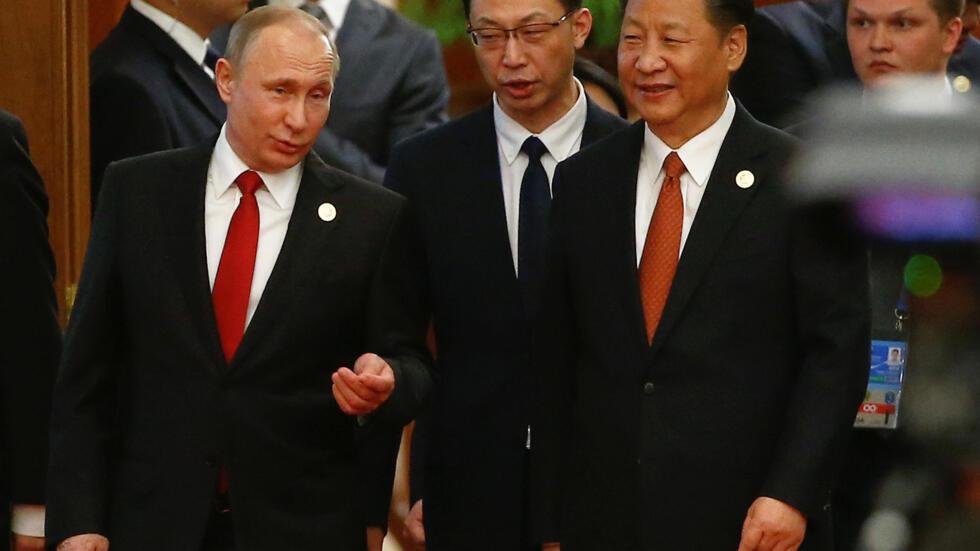 Chinese President Xi Jinping and Russian President Vladimir Putin arrive for the welcoming banquet for the Belt and Road Forum at the Great Hall of the People in Beijing, China May 14, 2017. 