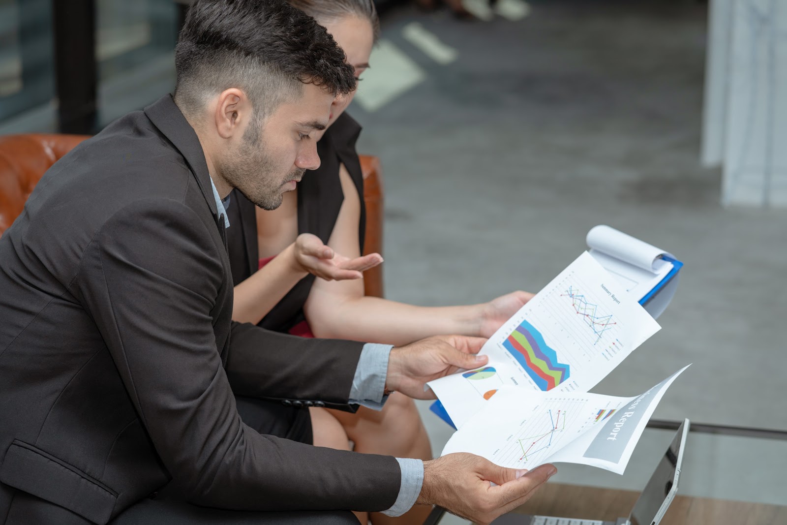 Two people checking a PPC report.