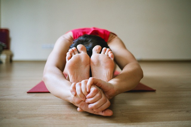 Man doing floor stretches.
