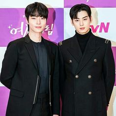 This  contain an image of Cha Eunwoo and Dong-hwi standing next to each other in front of a purple and white wall