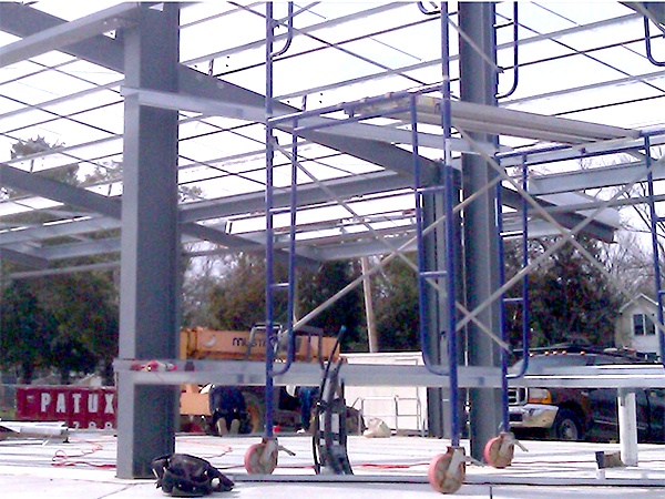 Scaffolding and steel framework in the early stages of constructing Selby on the Bay building.