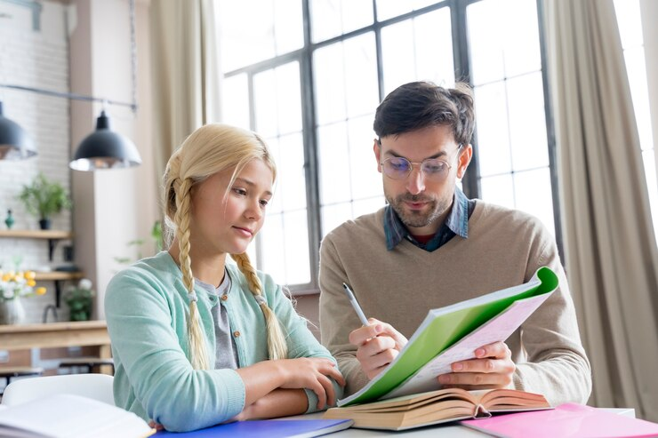 A teacher explaining something to a student