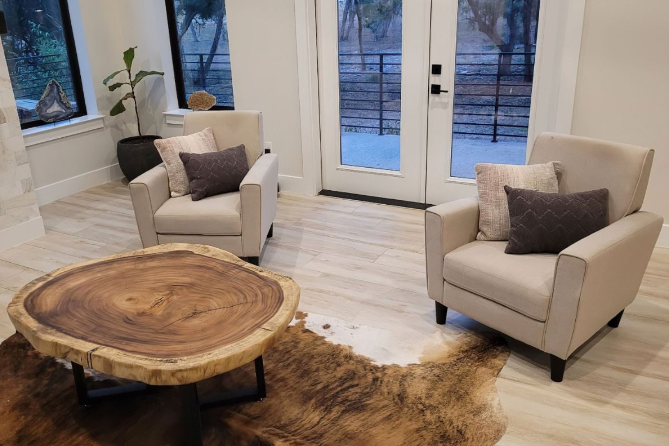 a round live edge coffee table in a living room