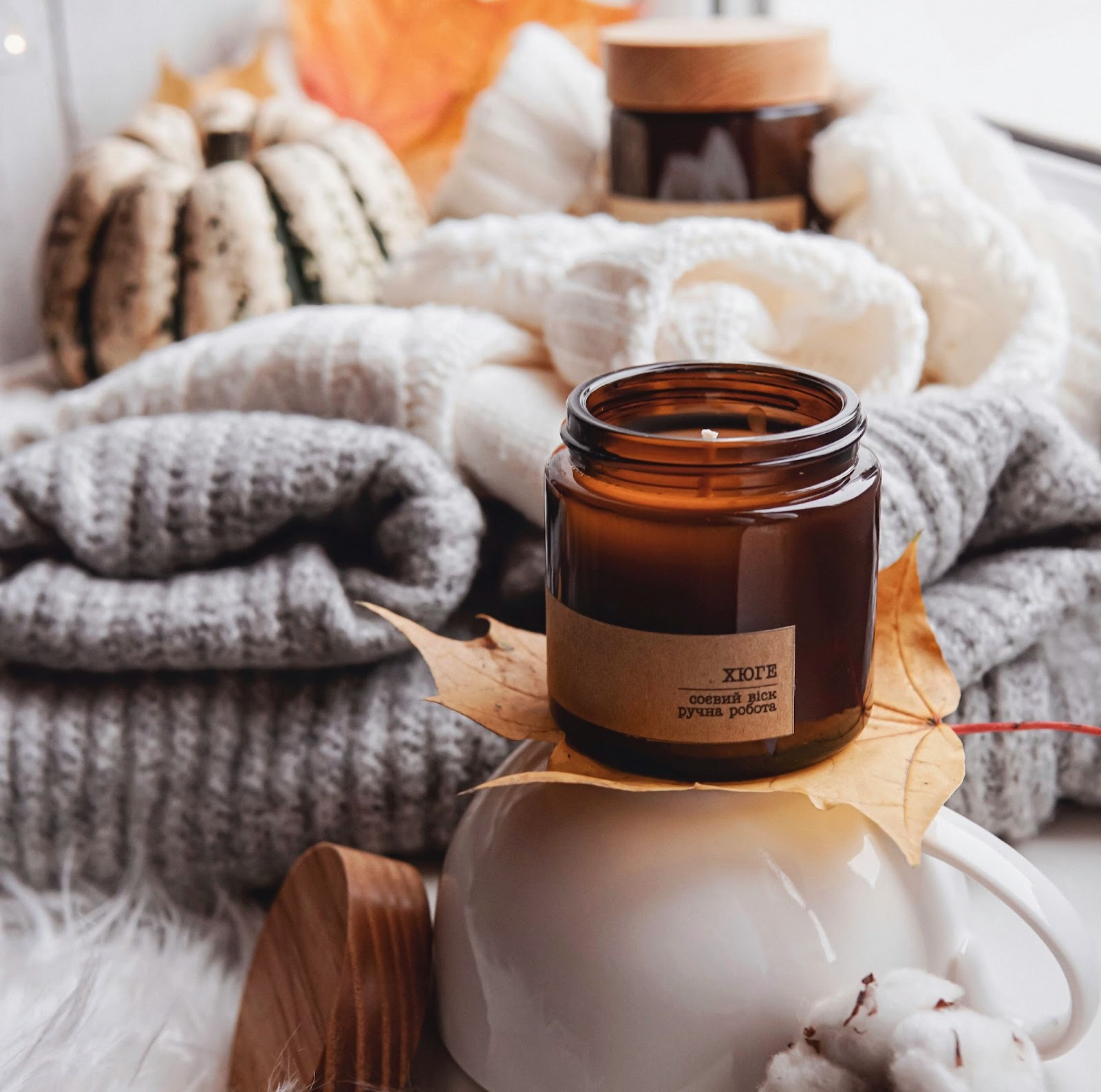 A cozy fall morning with cozy sweaters and scented candles.