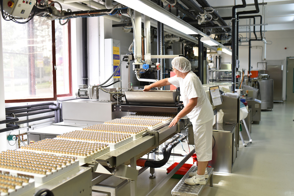 Female worker in a chocolate factory