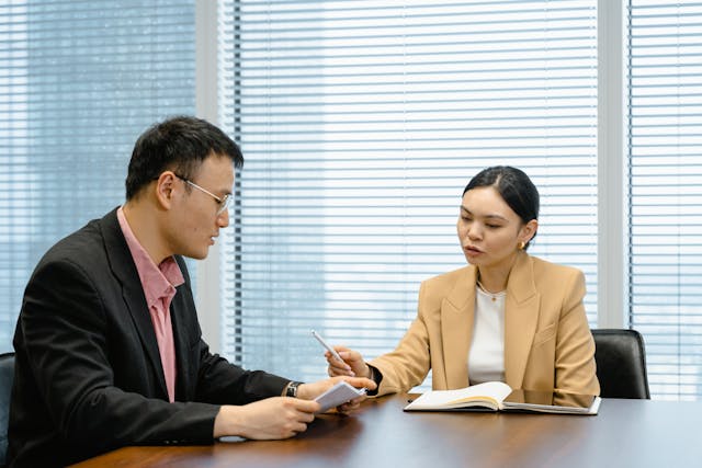 two people talking over a lease agreement