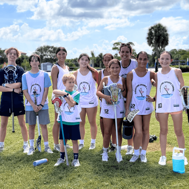 group of lacrosse players pose for a photo after practice at signature sports camp in Florida