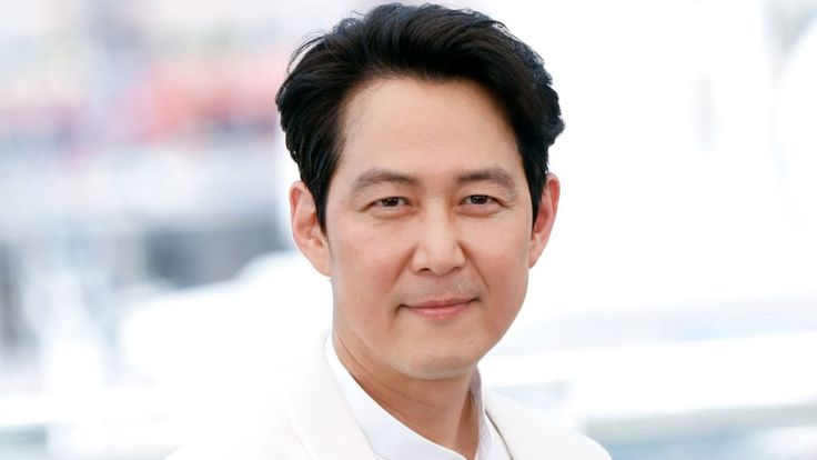 This  contain an image of  Lee Jung Jae wearing a white suit and tie