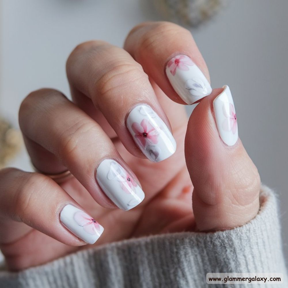 White Fall Nails having Delicate Floral Patterns
