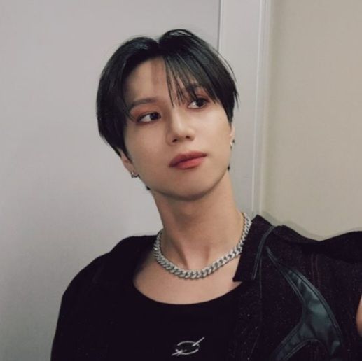 This contain SHINee's Taemin  with black hair wearing a necklace