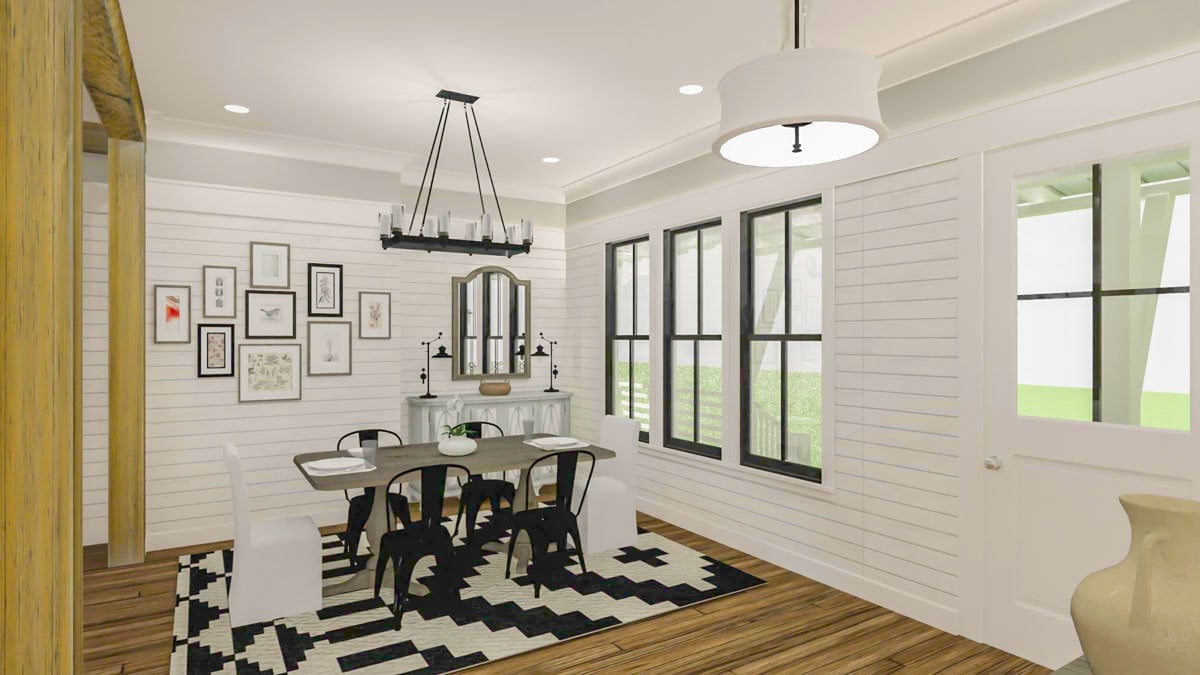 The dining area offers a buffet table and a wooden dining set sitting on a printed area rug.