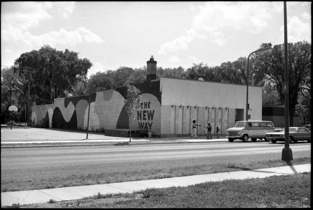 Image: The Way Opportunities Unlimited. Photo from Minnesota Historical Society. A black-and-white photo showing a building with a mural on the side that says, "THE NEW WAY".