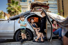 Three-year-old Mohammed, 14-year-old Sobhi, 6-year-old Rabia, and 12-year-old Dalal have lived for four days in their parents' car on the seafront in Beirut. "I miss my friends, school and my home," says Dalal.