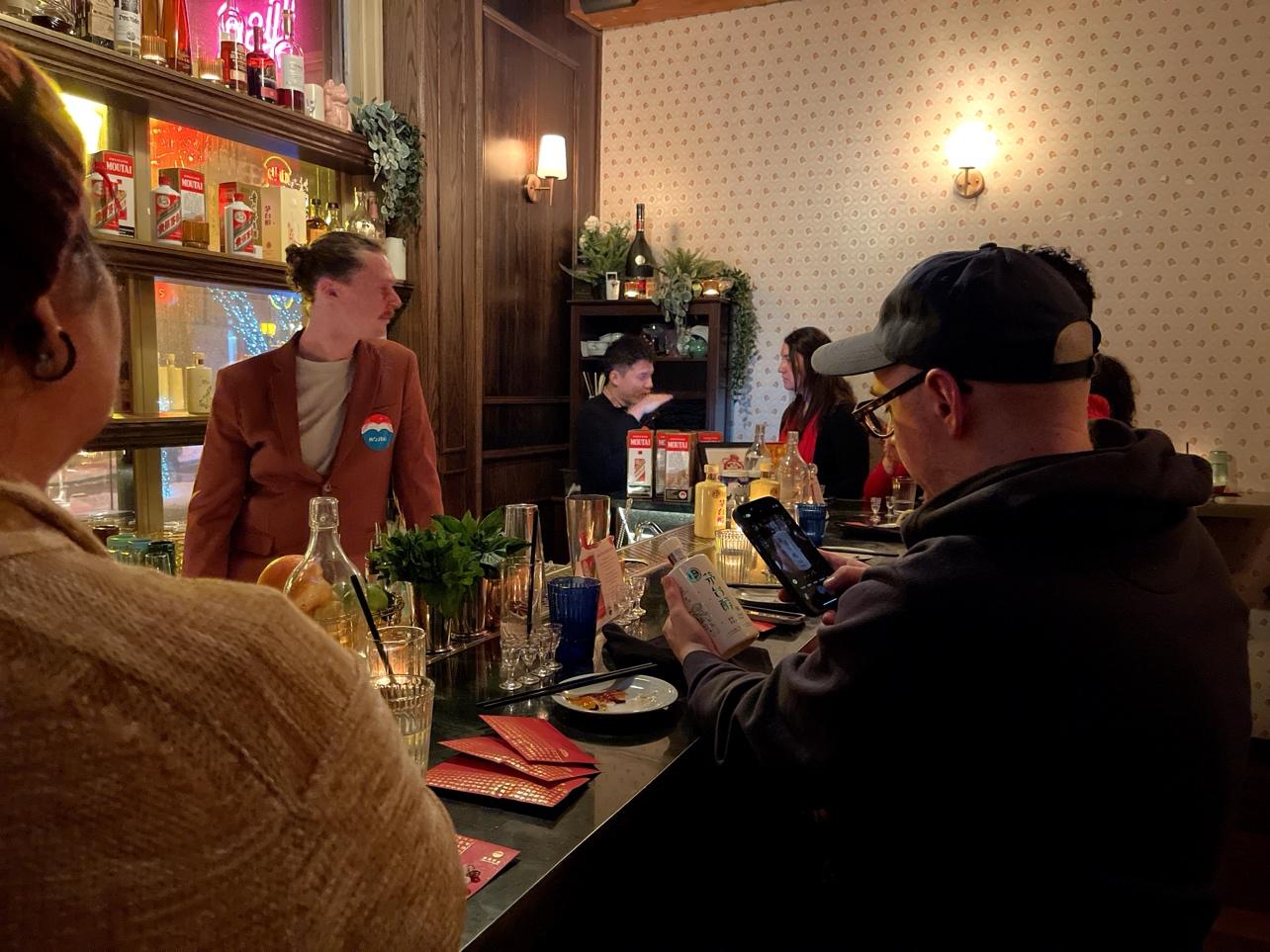 A group of people at a bar

AI-generated content may be incorrect.