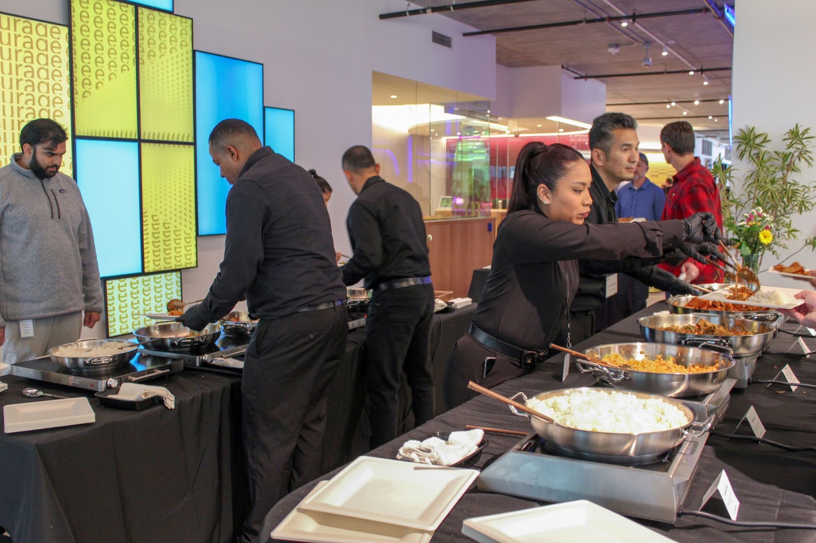 Superfine Kitchen workers serving a full service buffet to office employees 