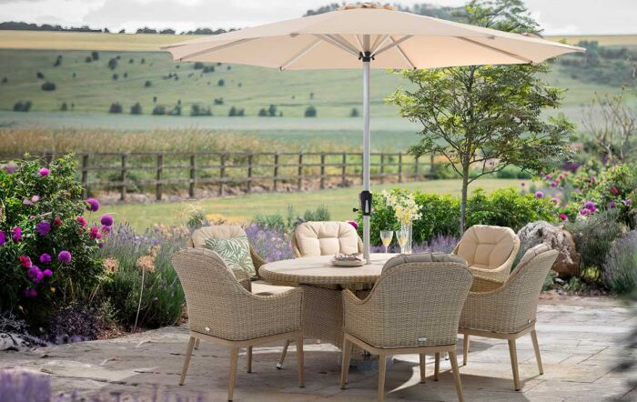 Bramblecrest Monterey Vogue Sandstone Oval Dining Set with Parasol and Base