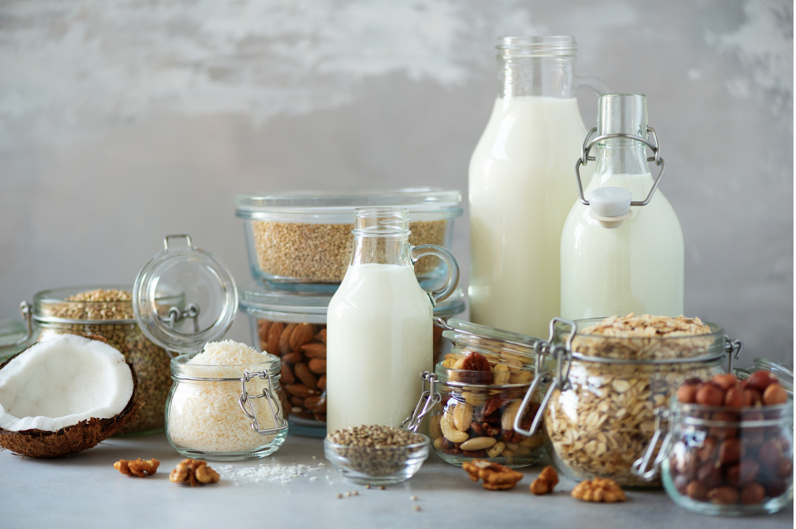 A picture of nut-based milks in different containers.