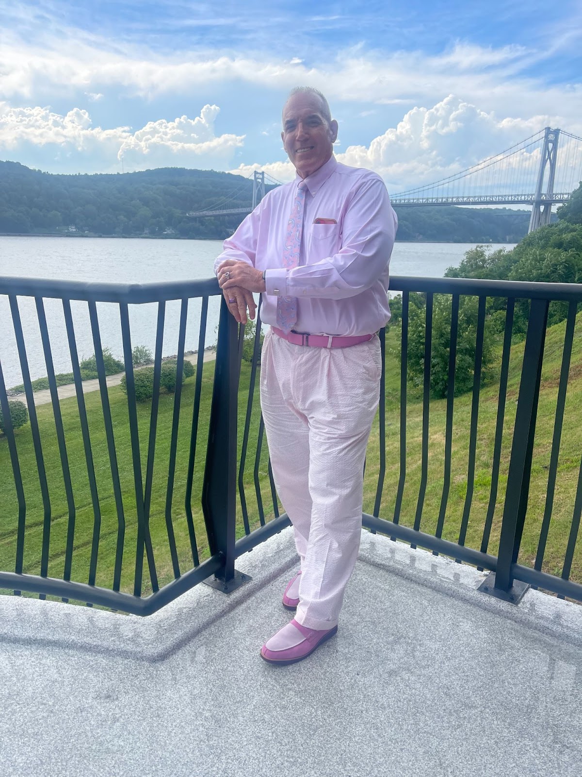 Man standing in front of scenic river